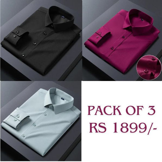 Three folded cotton shirts in black, maroon, and pink colors, displayed against a dark background with the text 'PACK OF 3' and 'RS 1899' on the bottom right corner.