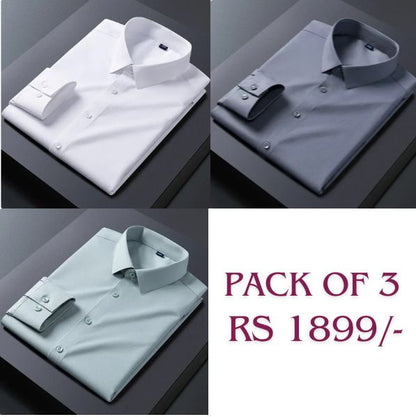 Three folded cotton shirts in white, dark grey, and pink colors, displayed on a flat surface, with the text 'PACK OF 3' and 'Rs 1899' on the bottom right corner.
