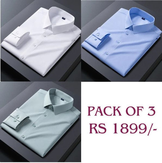 Three folded cotton shirts in white, blue, and green colors, displayed on a flat surface with a price tag indicating 'Pack of 3 Rs 1899'.