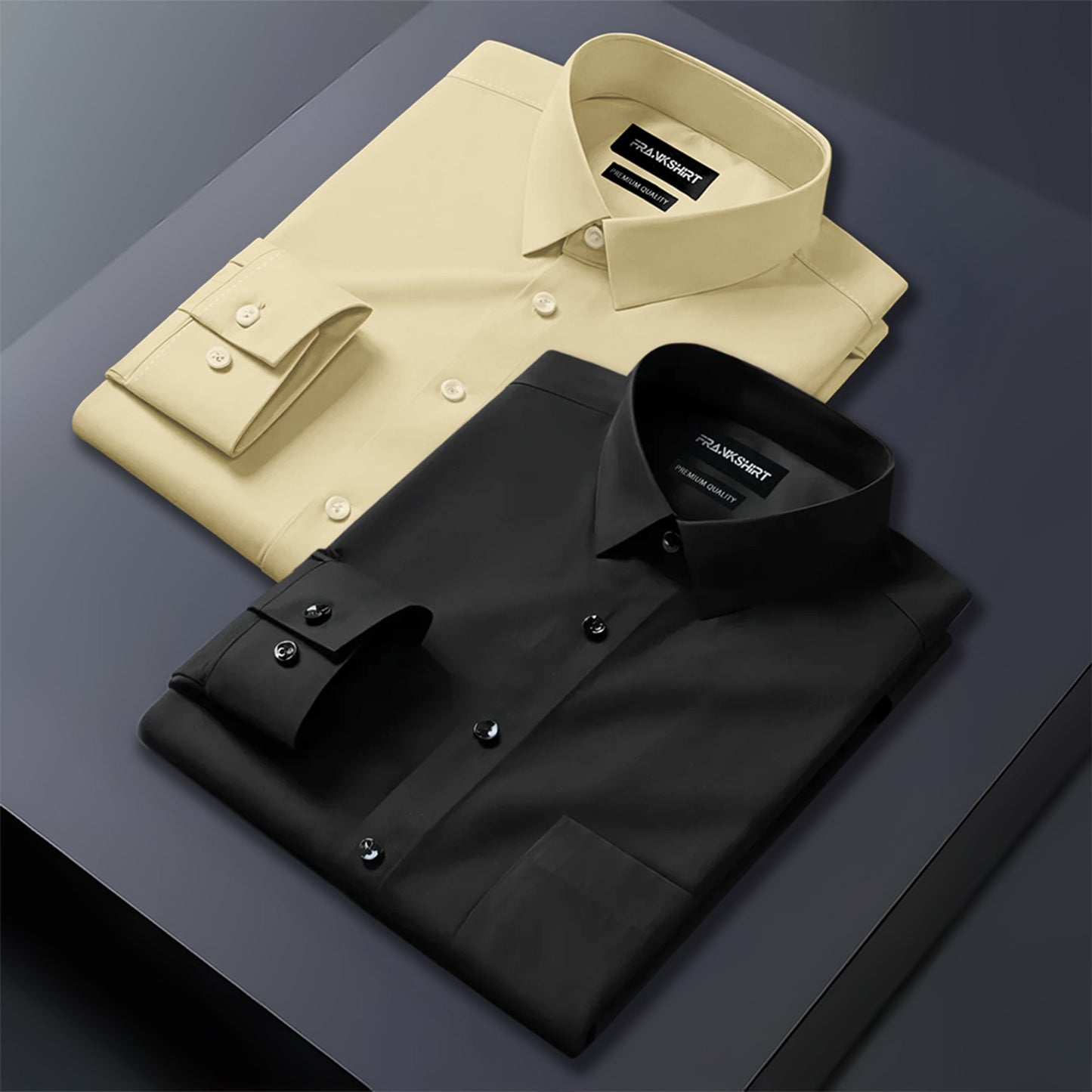 Two folded dress shirts, one beige and one black, on a dark surface.