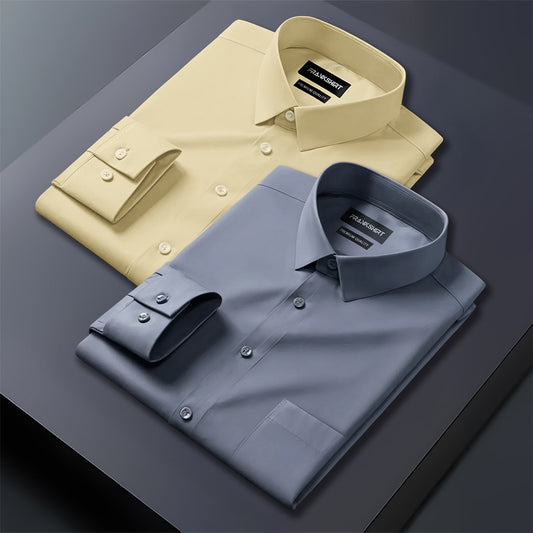Two folded dress shirts, one beige and one gray, on a dark surface.