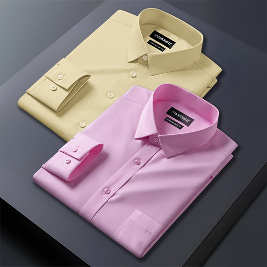Two folded dress shirts, one beige and one pink, on a dark surface.