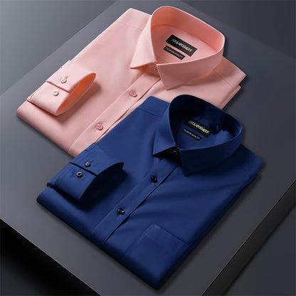 Pink and blue dress shirts with 'Kangra' label on a dark surface