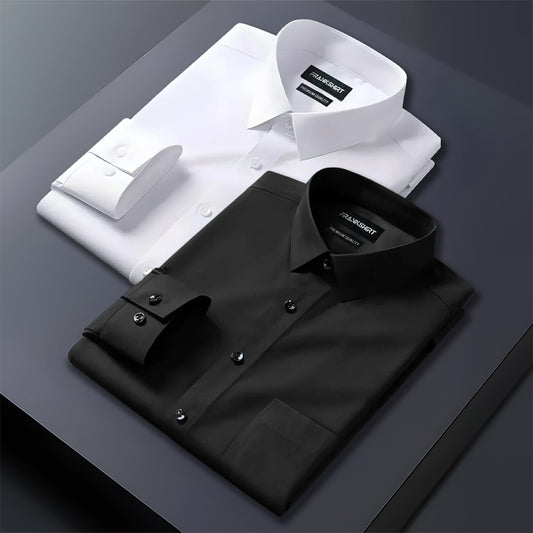 Folded black and white dress shirts on a dark surface with 'HANRO' branding.